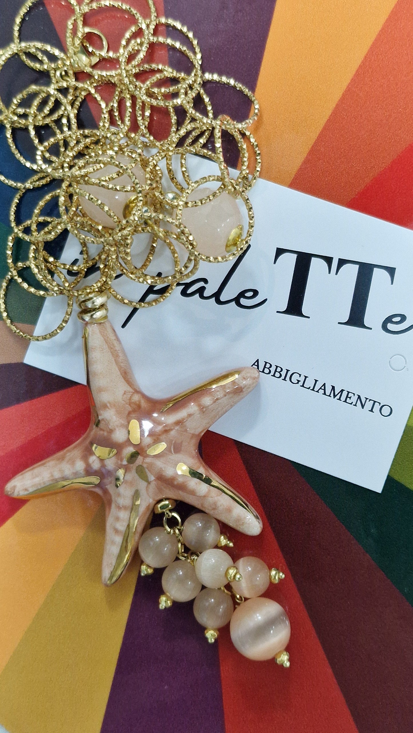 COLLANA STELLA D'ACQUA in paleTTe. abbigliamento