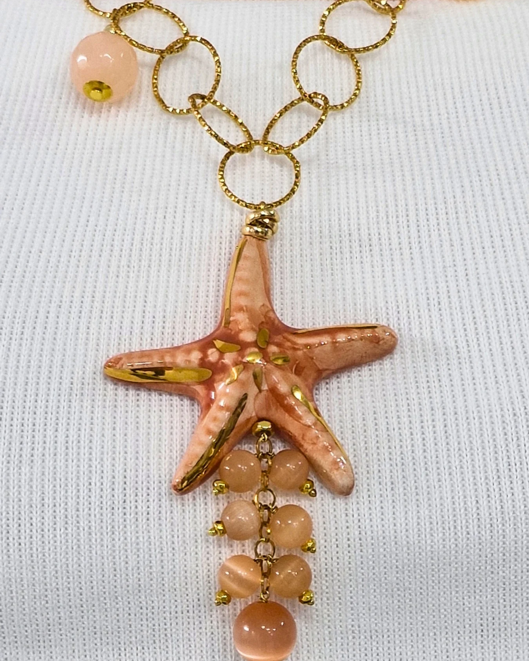 COLLANA STELLA D'ACQUA in paleTTe. abbigliamento