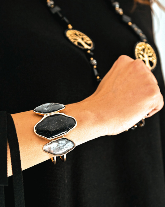 Bracciale nero rombi in paleTTe. abbigliamento